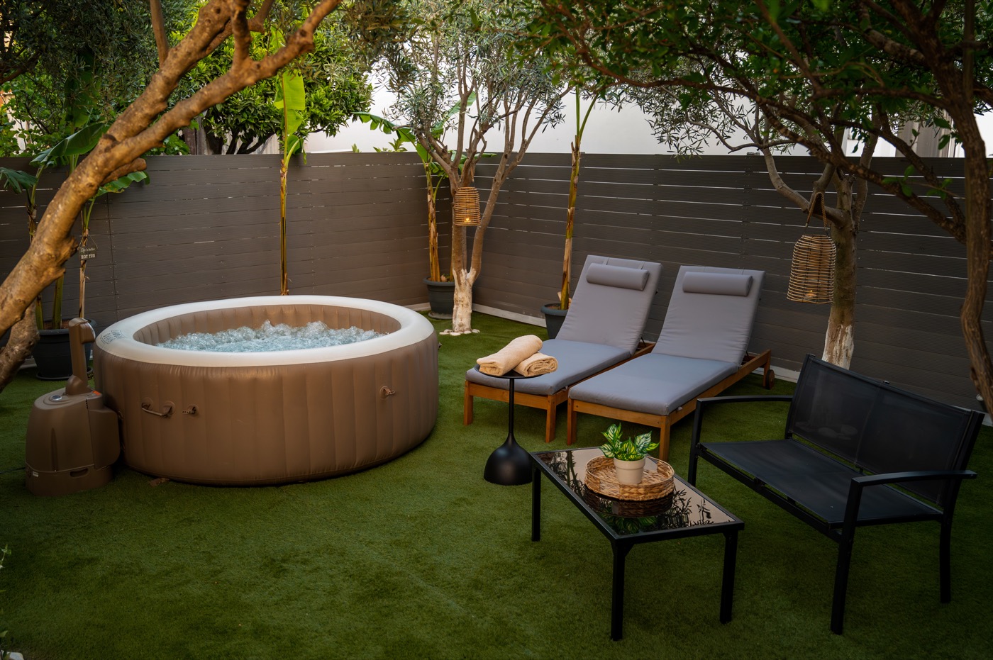 Home Away From Home garden lounge with hot tub and bench